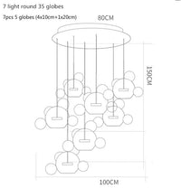 Lustre moderne en verre laiteux avec LED suspendue. | Marco Lucetti 7 lumières rondes