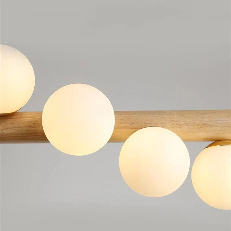 Lustre suspendu en bois massif et boules de verre blanc lait - Design Luxe | Marco Lucetti
