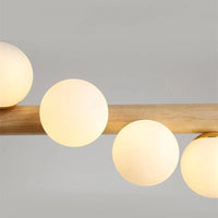 Lustre suspendu en bois massif et boules de verre blanc lait - Design Luxe | Marco Lucetti