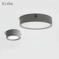 Plafonnier rond en ciment pour un salon moderne | Marco Lucetti