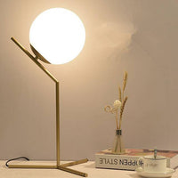 Lampe à poser dorée design