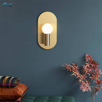Applique murale LED dorée en métal arrondi