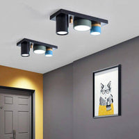 Plafonnier lumineux à LED avec spots cylindriques colorés