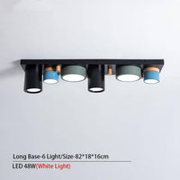 Plafonnier lumineux à LED avec spots cylindriques colorés