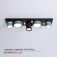 Plafonnier lumineux à LED avec spots cylindriques colorés
