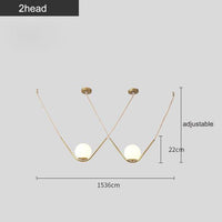 Suspension Arto : Boule de Verre avec Bras Doré