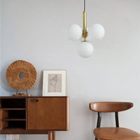 Suspension LED Luxe: Cylindre doré et boules en verre Fly