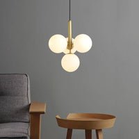 Suspension LED Luxe: Cylindre doré et boules en verre Fly