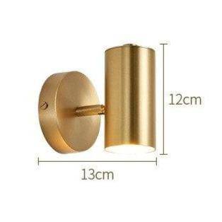 Applique murale LED dorée orientable.