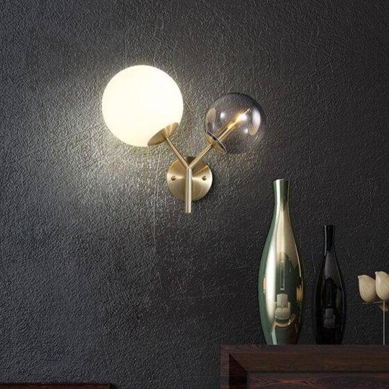 Applique murale LED dorée à deux boules en verre
