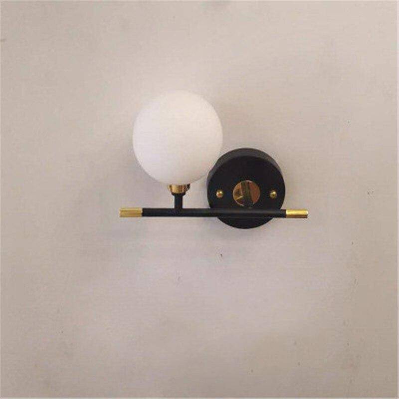 Applique murale dorée en verre boule