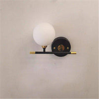 Applique murale dorée en verre boule