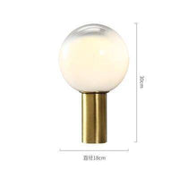 Lampe design LED dorée en verre blanc