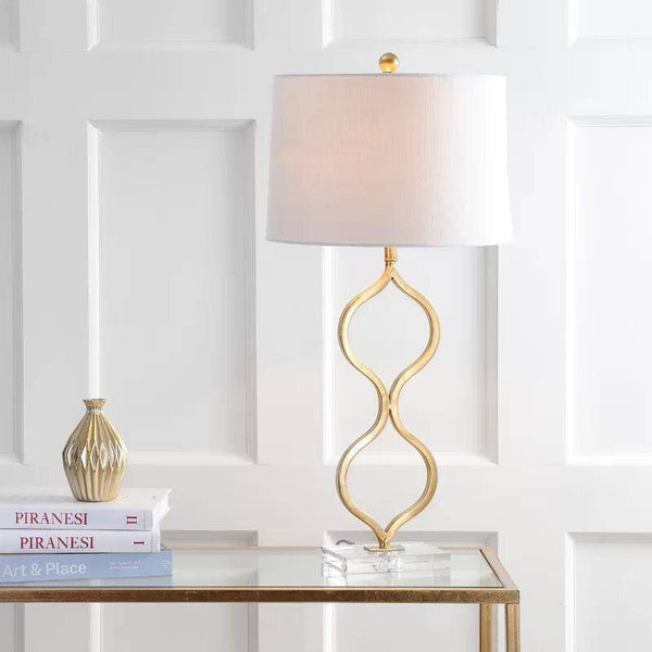 Lampe à poser LED dorée avec design courbé