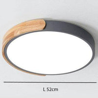 Plafonnier LED "Lumière Douce" en métal et bois$arrondi