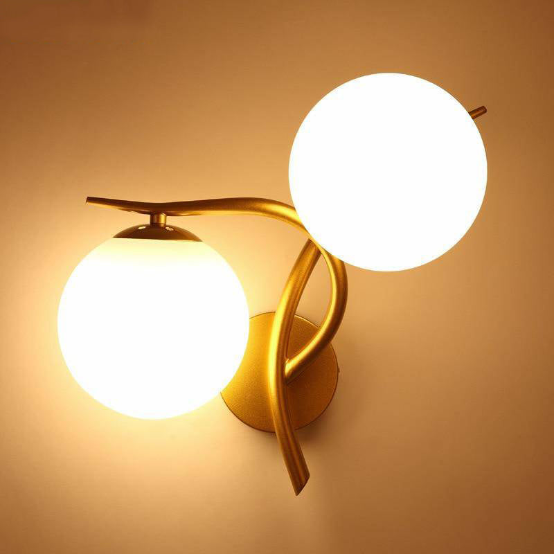 Applique murale LED design Croisée avec boule de verre (noir ou doré)