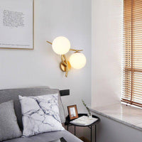 Applique murale LED design Croisée avec boule de verre (noir ou doré)