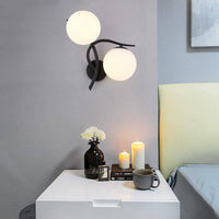 Applique murale LED design Croisée avec boule de verre (noir ou doré)