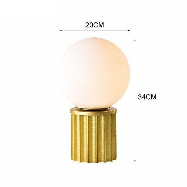 Lampe à poser design dorée avec boule LED