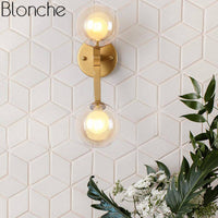 Applique murale dorée avec globe en verre RoyalSphere