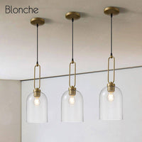Suspension LED en verre arrondi avec anneau doré