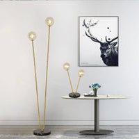 Lampe de chevet à deux branches dorées et boules en verre