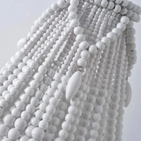 Suspension bohème en bois massif, artisanat authentique | Marco Lucetti