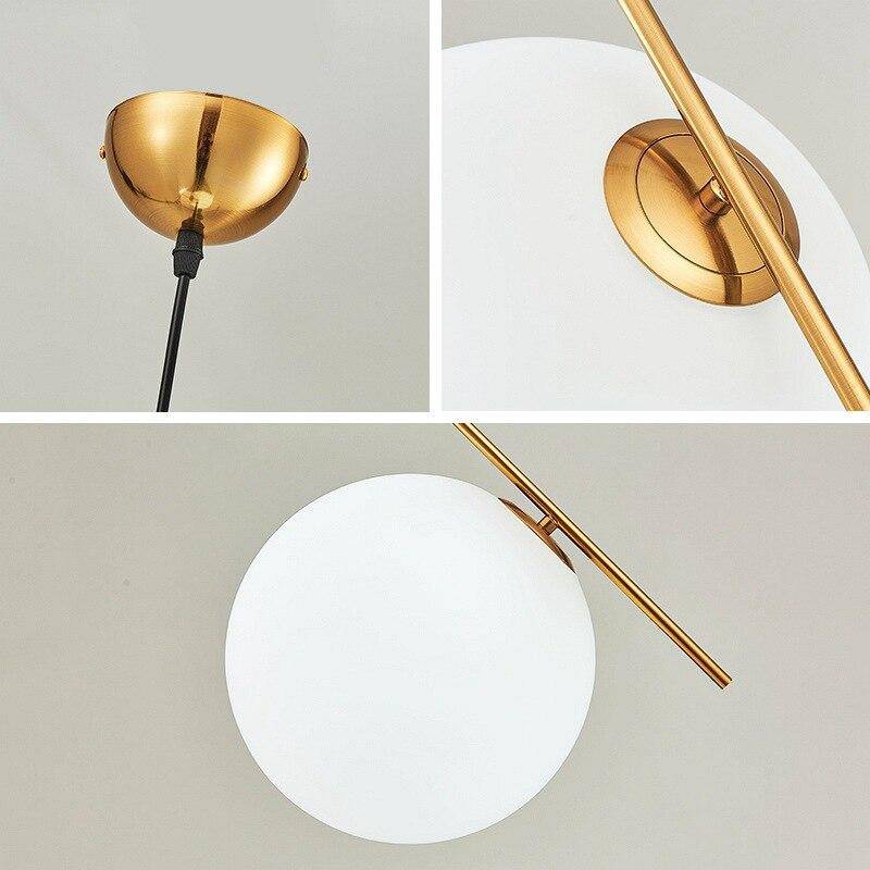 Suspension chic : barre dorée et boule en verre | Marco Lucetti
