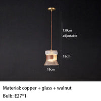 Suspension design en verre transparent avec accents bois et cuivre | Marco Lucetti