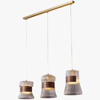 Suspension design en verre transparent avec accents bois et cuivre | Marco Lucetti