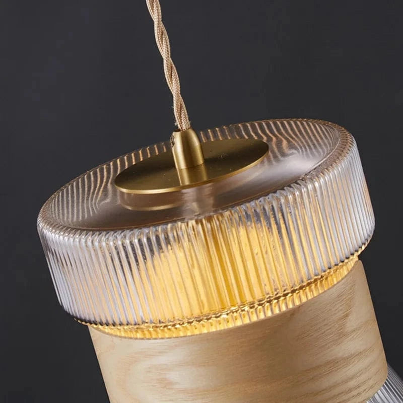 Suspension design en verre transparent avec accents bois et cuivre | Marco Lucetti