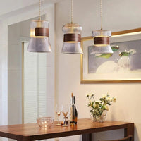 Suspension design en verre transparent avec accents bois et cuivre | Marco Lucetti