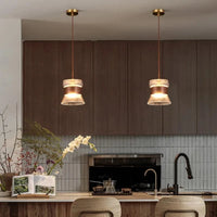 Suspension design en verre transparent avec accents bois et cuivre | Marco Lucetti