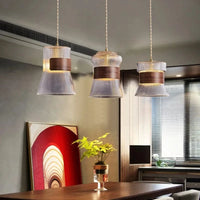 Suspension design en verre transparent avec accents bois et cuivre | Marco Lucetti