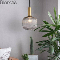 Suspension en verre coloré et base dorée, style élégant. | Marco Lucetti Fumé