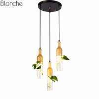 Suspension LED en bois avec plante et réservoir d'eau Bottle - Luminaire EcoGreen | Marco Lucetti 3 lampes - Base ronde