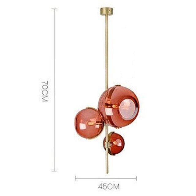 Suspension LED Luxe : Tige dorée, 3 boules verre rouge | Marco Lucetti