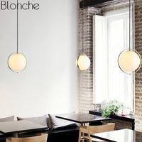 Suspension LED moderne en verre et métal doré | Marco Lucetti