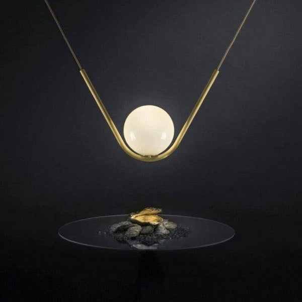Suspension luminaire en métal doré et verre transparent | Marco Lucetti