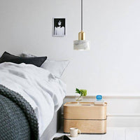 Suspension Luxury LED dorée sur marbre blanc | Marco Lucetti