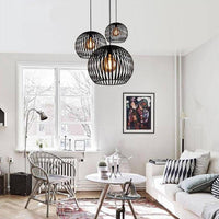 Suspension ronde vintage en cage (noir ou blanc) | Marco Lucetti