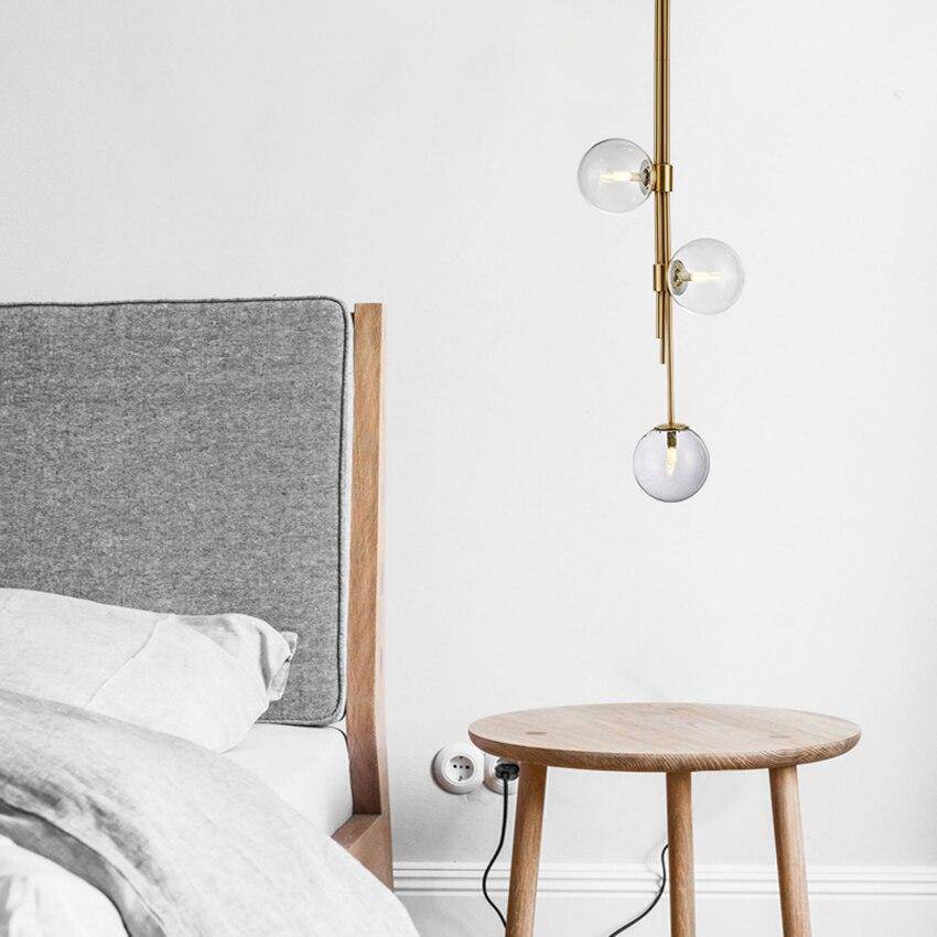 Suspension tube doré avec boules en verre contemporain | Marco Lucetti