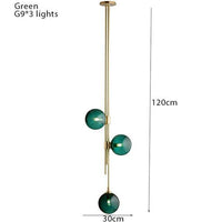 Suspension tube doré avec boules en verre contemporain | Marco Lucetti 3 lampes - vert